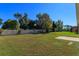 Large grassy backyard with block wall and patio at 4029 Marina Isle Dr, Kissimmee, FL 34746