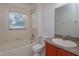 Bathroom with tub, toilet, and single vanity at 4029 Marina Isle Dr, Kissimmee, FL 34746