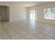 Large living room featuring tile floors and backyard access at 4029 Marina Isle Dr, Kissimmee, FL 34746