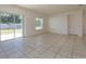 Bright living room with tile floors and sliding glass doors at 4029 Marina Isle Dr, Kissimmee, FL 34746