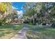 Landscaped backyard with patio furniture and house view at 4108 Downeast Ln, Windermere, FL 34786