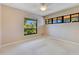 Bright bedroom featuring a large window and carpet flooring at 4108 Downeast Ln, Windermere, FL 34786