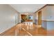 Hardwood floors and a view into the kitchen area at 4108 Downeast Ln, Windermere, FL 34786