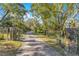 Long driveway with gated entrance leading to home at 4108 Downeast Ln, Windermere, FL 34786