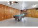 Game room featuring a pool table and wood paneled walls at 4108 Downeast Ln, Windermere, FL 34786