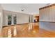 Bright living room featuring hardwood floors and a view into dining area at 4108 Downeast Ln, Windermere, FL 34786