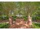 Park entrance with brick pillars and a flagpole at 4108 Downeast Ln, Windermere, FL 34786