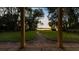 Brick pathway leading to a peaceful lake view at 4108 Downeast Ln, Windermere, FL 34786