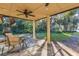 Relaxing patio area with spiral staircase and water views at 4108 Downeast Ln, Windermere, FL 34786