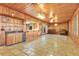 Wet bar with wood cabinetry and tile flooring at 4108 Downeast Ln, Windermere, FL 34786