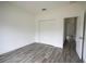 Bedroom with double door closet and gray tile floors at 431 Rainbow Ct, Kissimmee, FL 34759