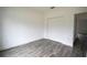 Bedroom with double door closet and wood-like tile floors at 431 Rainbow Ct, Kissimmee, FL 34759