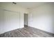 Spacious bedroom with double door closet and gray tile floors at 431 Rainbow Ct, Kissimmee, FL 34759