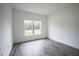 Bright bedroom with gray tile floors and large window at 431 Rainbow Ct, Kissimmee, FL 34759