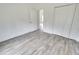 Bedroom with double door closet and wood-like tile floors at 431 Rainbow Ct, Kissimmee, FL 34759