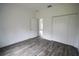 Simple bedroom with double door closet and gray tile floors at 431 Rainbow Ct, Kissimmee, FL 34759