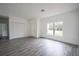 Bright living room with gray tile floors and large window at 431 Rainbow Ct, Kissimmee, FL 34759