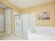 Bathroom with shower, bathtub, and neutral tile at 5012 Shoreway Loop # 10207, Orlando, FL 32819