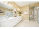 Bathroom featuring double sinks, large counter and tile floors at 5012 Shoreway Loop # 10207, Orlando, FL 32819