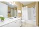 Bathroom featuring a shower, vanity, toilet and mirror at 5012 Shoreway Loop # 10207, Orlando, FL 32819