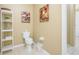 Clean bathroom with toilet and shelf at 5012 Shoreway Loop # 10207, Orlando, FL 32819