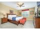 Main bedroom with king-size bed and wood furniture at 5012 Shoreway Loop # 10207, Orlando, FL 32819