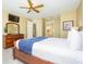 Comfortable bedroom with king bed, dresser, and access to bathroom at 5012 Shoreway Loop # 10207, Orlando, FL 32819