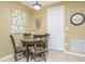 Cozy dining area with a round table and four chairs at 5012 Shoreway Loop # 10207, Orlando, FL 32819