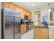 Modern kitchen with stainless steel appliances and granite countertops at 5012 Shoreway Loop # 10207, Orlando, FL 32819