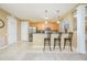 Modern kitchen with stainless steel appliances and light wood cabinets at 5012 Shoreway Loop # 10207, Orlando, FL 32819