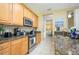 Kitchen with stainless steel appliances and granite countertops at 5012 Shoreway Loop # 10207, Orlando, FL 32819