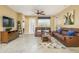 Spacious living room with comfortable seating and large TV at 5012 Shoreway Loop # 10207, Orlando, FL 32819