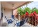 Relaxing patio with outdoor seating, overlooking tropical landscape at 5012 Shoreway Loop # 10207, Orlando, FL 32819