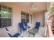 Relaxing patio with seating and glass top table at 5012 Shoreway Loop # 10207, Orlando, FL 32819