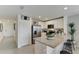 Modern kitchen with white cabinets, granite countertops and stainless steel appliances at 6614 Leo Ln, St Cloud, FL 34773