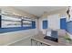 Home office with wood desk and blue accent wall at 6614 Leo Ln, St Cloud, FL 34773