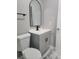 Updated bathroom with gray vanity and marble floors at 701 Titcomb St, Eustis, FL 32726