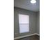 Well-lit bedroom with a window and neutral walls at 701 Titcomb St, Eustis, FL 32726