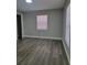 Bedroom with gray walls, vinyl flooring, and window blinds at 701 Titcomb St, Eustis, FL 32726