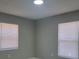 Bedroom with gray walls, vinyl flooring, and window blinds at 701 Titcomb St, Eustis, FL 32726