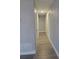 Hallway with gray walls and vinyl plank flooring at 701 Titcomb St, Eustis, FL 32726