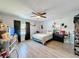 Cozy bedroom with a queen-size bed and built-in shelving at 7211 Pinion Dr, Orlando, FL 32818