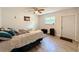 Bedroom with a double bed, ceiling fan and wood-look floors at 7211 Pinion Dr, Orlando, FL 32818