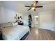 Well-lit bedroom with a comfortable bed and ensuite bathroom at 7211 Pinion Dr, Orlando, FL 32818