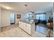 Kitchen island with granite countertop, white cabinets at 7211 Pinion Dr, Orlando, FL 32818