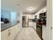 Modern kitchen with stainless steel appliances and granite countertops at 7211 Pinion Dr, Orlando, FL 32818