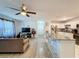 Open concept living room and kitchen with hardwood floors at 7211 Pinion Dr, Orlando, FL 32818