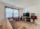 Cozy living room with hardwood floors and large windows at 7211 Pinion Dr, Orlando, FL 32818