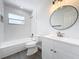 Updated bathroom, featuring white subway tile and a bathtub at 767 Trailwood Dr, Altamonte Springs, FL 32714