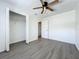 Bedroom with grey vinyl flooring, a large closet, and ceiling fan at 767 Trailwood Dr, Altamonte Springs, FL 32714